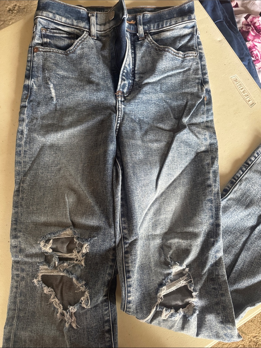 Express woman’s Light Blue Distressed Relaxed Jeans